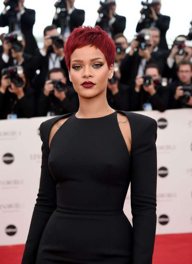 Rihanna's bold red pixie cut at the 2013 Academy Awards Rihanna with vibrant red pixie cut at 2013 Oscars